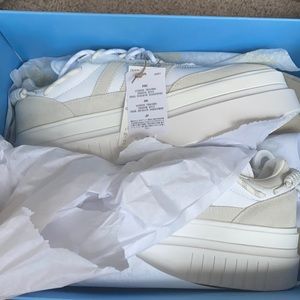 Cream colored Adidas platform shoes